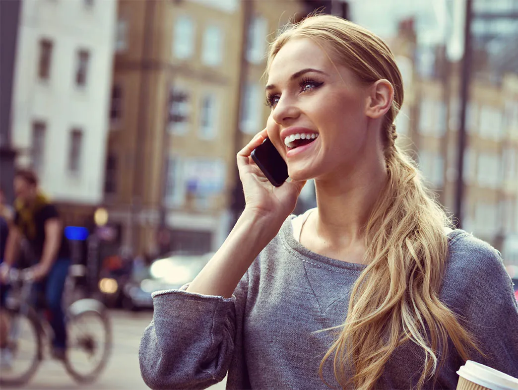 Advisor smiling on a phone call